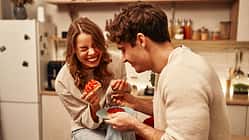 Happy,Valentine's,Day.,Young,Couple,In,Love,Eating,Cakes,While