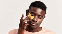 Close,Up,Portrait,Of,Young,Handsome,Black,Guy,Applying,Cosmetic