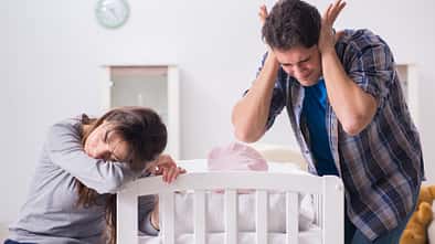 Cute,Nice,Little,Baby,Girl,Crying,Lying,With,Her,Mom