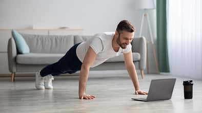 Happy,Middle-aged,Man,In,Sportswear,Doing,Push-ups,,Using,Laptop,,Having