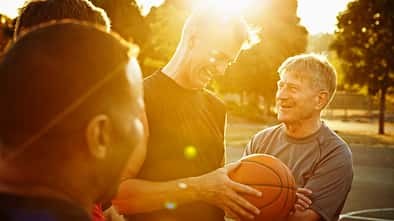 Laughing group of basketball players on court