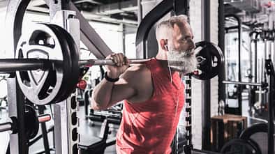 Serious,Mature,Male,Is,Having,Intense,Workout,In,Gym