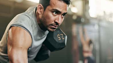 Serious,Man,,Dumbbell,And,Weightlifting,In,Workout,,Exercise,Or,Fitness