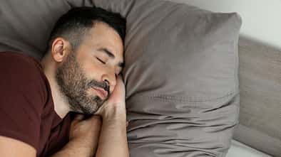 Man,Napping,Holding,Hands,Behind,Head,Sleeping,On,Side,,Lying