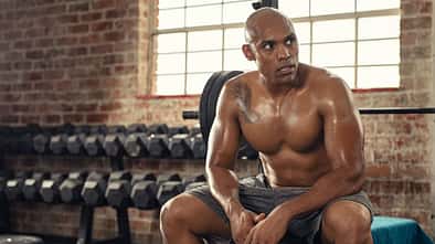 Shirtless,African,Sportsman,Resting,After,Training,At,Gym.,Mature,Muscular