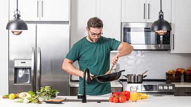 Chef,Cook,Cooking,With,Pan,At,Kitchen.,Chef,Cook,Prepares