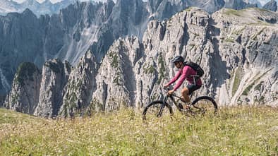 Mountain biking in Dolomites mountains.