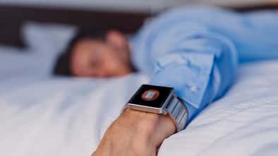 Businessman sleeping on bed.