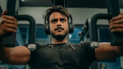 Determined Fitness Enthusiast Working Out on Chest Press Machine – Intense Gym Training Concept