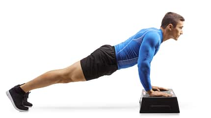 muscular,strong,young,caucasian,isolated,slim,exercise,guy,train Muscular,Man,Exercising,Push-ups,On,A,Step,Aerobic,Platform,Isolated