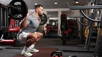 muscular,handsome,strength,squats,young,caucasian,back,exercise, Athletic,Young,Man,Doing,Barbell,Squats,In,The,Fitness,Gym