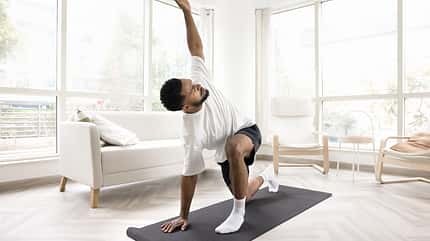 american practice,workout indoors,sport shorts,hip 20s,morning b Serious,Young,Black,Man,Doing,Morning,Exercises,At,Home,,Keeping