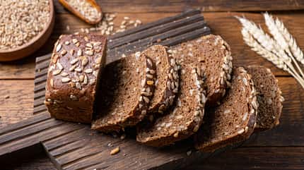 seed,taste,isolated,sunflower seeds,rustic,linseed,napkin,slice, Whole,Grain,Rye,Bread,With,Sunflower,Seeds,Cut,On,A