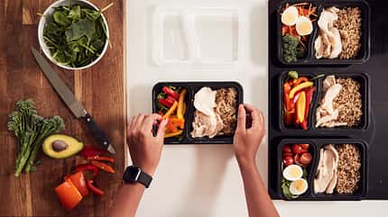 container,lunch,prepared,home cooked,at home,one person,horizont Overhead,Shot,Of,Woman,Preparing,Batch,Of,Healthy,Meals,At