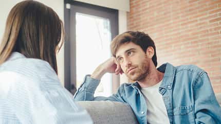 enjoy together,comfortable feel,casual chatting,partner solution Serious,Young,Couple,Sitting,Together,On,Sofa,,Talking,About,Relationships,