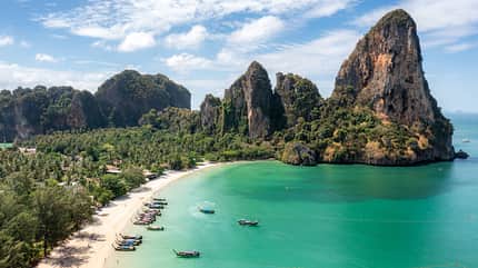 Aerial view of Railay beach seen from a drone One of Thailand's most famous luxurious beach in summer sunny day in Krabi, Thailand. Aerial view of Railay beach seen from a drone One of Thailand's most famous luxurious beach in summer sunny day in Krabi, Thailand.