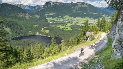 Extreme Sports,Sports Helmet,Leisure Activity,Ausseerland,No People,Environmental Conservation,Men,Males,Bad Mitterndorf,Dirt Road,Steep,Moving Down,Exercising,Scenics,Mountain Bike,Speed,High Up,Sport,Vacations,Nature,Outdoors,Panoramic,Hiking,Recreational Pursuit,Austria,Summer,Rock - Object,Dachstein Mountains,European Alps,Mountain Range,Mountain,Meadow,Landscape,Lake,Single Lane Road,Road,Footpath,Village,Bicycle,ödensee Mountain Bike Trail, Lake Ödensee, Austrian Alps Panorama