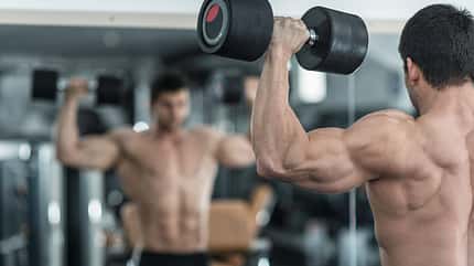 Body,Building,Champion,Exercising,In,The,Gym,,Standing,On,Front