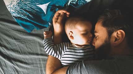 Father and son sleeping in bed Father and son sleeping in bed