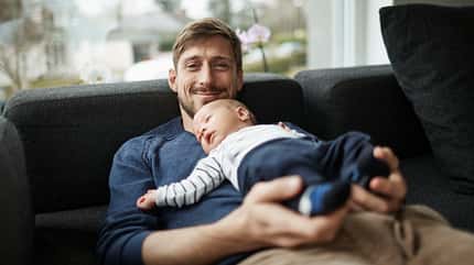 looking at camera:CB2,father:CB3,two people:CB2,human relationships:CB2,domestic scene:CB2,happiness:CB2,caring:CB2,cute:CB2,love:CB2,relaxation:CB2,smiling:CB2,togetherness:CB2,35-39 years:CB2,mid-adult man:CB2,baby boy:CB2,Caucasian ethnicity:CB2,family:CB2,son:CB2,fatherhood:CB3,indoors:CB2,infant:CB2,leisure:CB2,lying down:CB2,living room:CB2,sofa:CB2,millennial generation:CB3 Smiling father and baby boy lying on couch