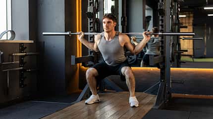 muscular,handsome,strong,sports center,activity,weight lifting,y Strong,Sportsman,Squat,With,Barbell,In,Gym,,Young,Strong,Guy