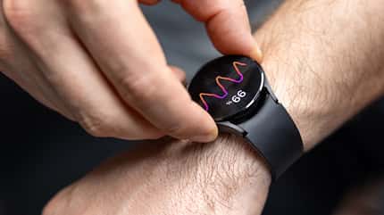 Male athlete monitoring heart rate recovery on smartwatch after completing high intensity cross training exercise session Male athlete monitoring heart rate recovery on smartwatch after completing high intensity cross training exercise session