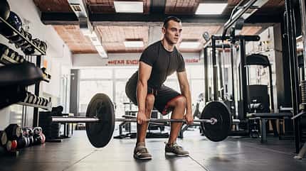 Young man weightlifting