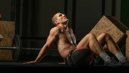 Young,Muscular,Man,Drinking,Protein,Shake,After,Working,Out,Indoors.