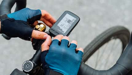 Cyclist's,Hands,Use,A,Computer,For,A,Bicycle,,Close-up,Photo.