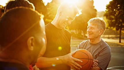 Laughing group of basketball players on court
