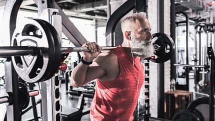 Serious,Mature,Male,Is,Having,Intense,Workout,In,Gym