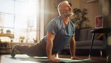 Strong,Athletic,Fit,Senior,Man,Training,On,A,Yoga,Mat,