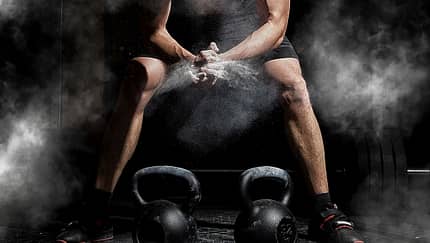 Weightlifter,Clapping,Hands,And,Preparing,For,Workout,At,A,Gym.