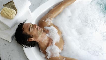 Man,Laying,In,Bubble,Bath