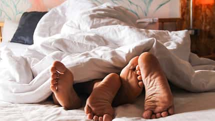 Passionate,Love.,Feet,Of,A,Young,Couple,That,Lying,On