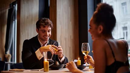 Happy,Man,In,Evening,Attire,Holding,Glass,Of,Wine,And