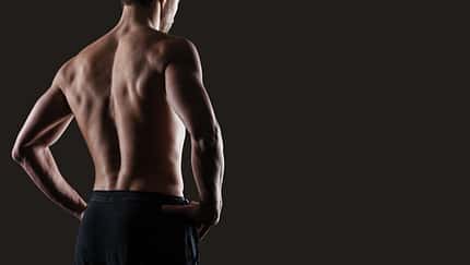 Attractive,Sensual,Man,Posing,And,Showing,Off,His,Muscular,Back,