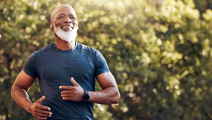 Happy,Black,Man,Running,In,Park,With,Music,,Smile,And
