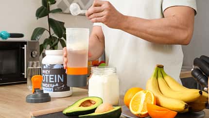 Sporty,Muscular,Man,Pouring,Protein,Powder,Into,Bottle,For,Shake