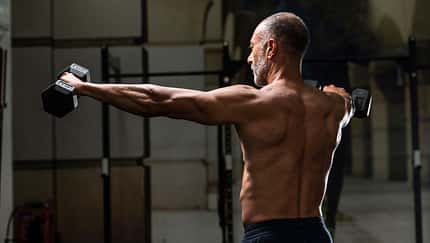 Backward,View,Of,A,Muscular,Shirtless,Mature,Older,Bodybuilding,Athlete