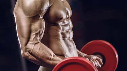 Fit,Man,Training,Training,Arm,Muscles,At,Gym.,Pumping,Up