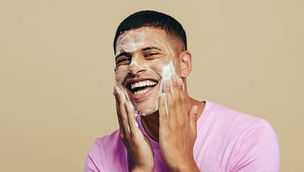 Portrait,Of,A,Handsome,Young,Man,Indulging,In,His,Grooming