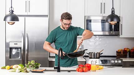 Chef,Cook,Cooking,With,Pan,At,Kitchen.,Chef,Cook,Prepares