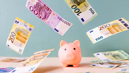 Piggy bank and falling European Union currency