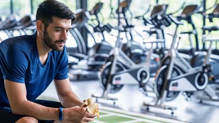 Sports,Man,Eating,Banana,During,Training,In,Gym.