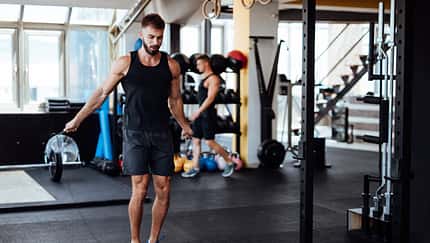 Young man skipping rope in the gym Young man skipping rope in the gym