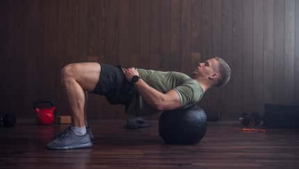 Handsome Blond Man Exercising at the Gym