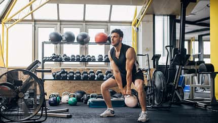 Man training with kettlebell