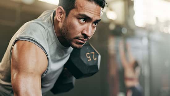 Serious,Man,,Dumbbell,And,Weightlifting,In,Workout,,Exercise,Or,Fitness