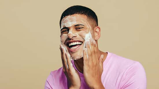 Portrait,Of,A,Handsome,Young,Man,Indulging,In,His,Grooming